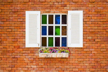 Fototapeta na wymiar wooden window on the vintage brick wall