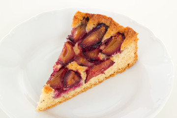 Slice of the Zwetschgenkuchen on white dish