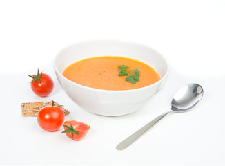 Tomato cream soup garnished with salad