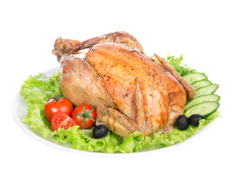 Garnished roasted thanksgiving chicken on a plate