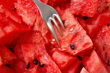 Watermelons slices with the spoon