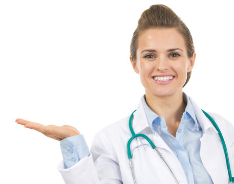 Smiling Doctor Woman Presenting Something On Empty Palm