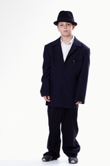 Obraz na płótnie Canvas Young staying boy wearing a suit