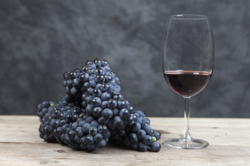 Red wine and grapes