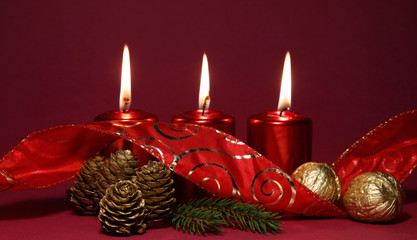 Three burning red candles
