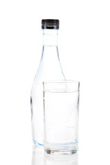 Water in glass and plastic bottle