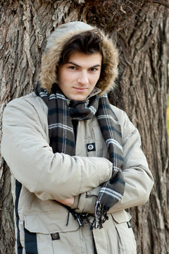 Young man portrait in park.