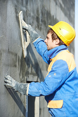 worker at plastering facade work