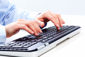 Hands with a computer keyboard.