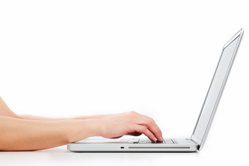 Hands with laptop computer. © grinny