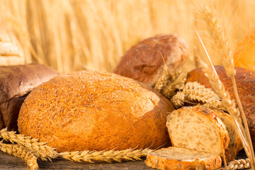 Homemade bread and wheat on the wooden table