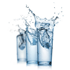 water splash in glasses isolated on white