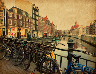 Fototapeta premium Amsterdam, Netherlands . Photo in retro style. Paper texture.