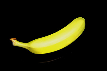 Banana on reflecting black table