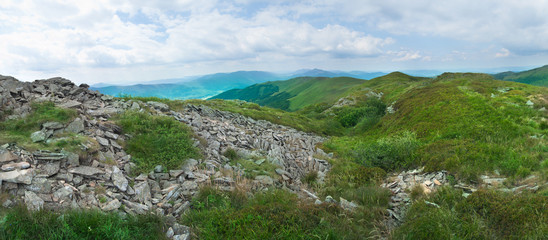 Fototapeta na wymiar Beautiful green mountain panorama with blue sky above