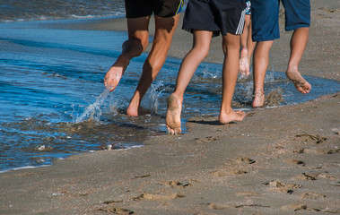 barefoot running on a sandy beach