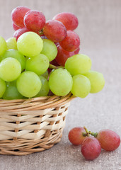 Green and red grapes in a basket
