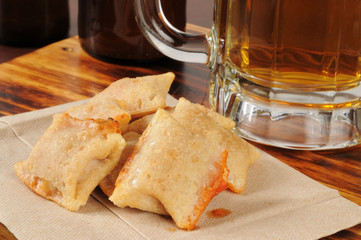 Bar snacks. Pizza rolls and beer