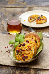 Breakfast buns with vegetables in wicker basket