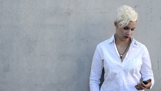 Woman reading a message and smiling