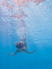 Young woman undewater
