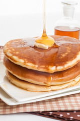 Pancakes with butter and syrup.