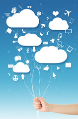 Hand holding clouds(balloons)
