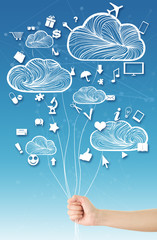 Hand holding clouds(balloons