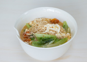 Thai vegetable noodle spicy in white bowl