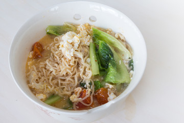 Thai vegetable noodle spicy in white bowl