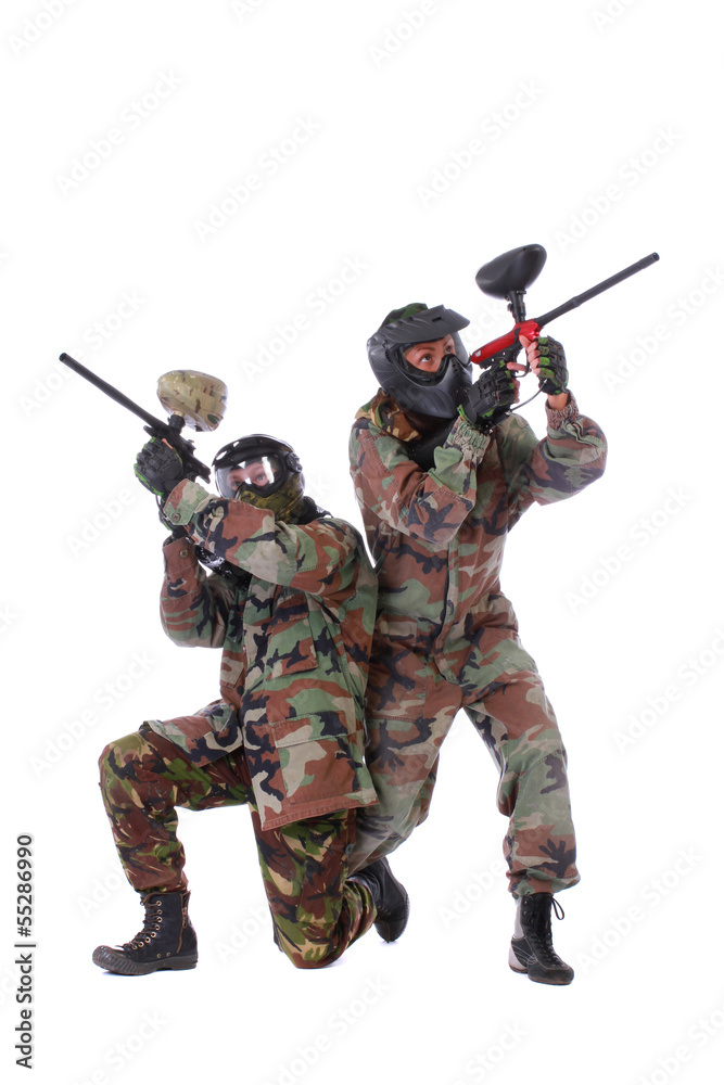 Wall mural Studio shot of two paintball players over white background