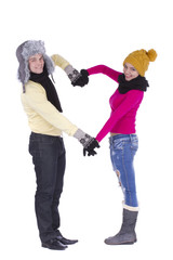 Couple in winter clothes making heart shape