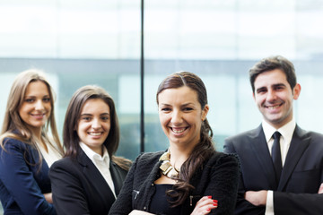 Businesswoman on the foreground of his collegues