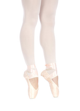 Lower half waist down image of ballerina dancing