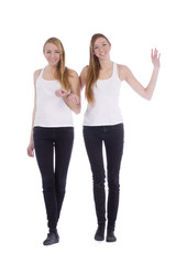 Fototapeta premium Two girls twins best friends concept isolated on white