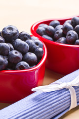 blueberries in a beautiful red heart-shaped bowls. full of vitam