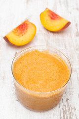 glass of fresh squeezed peach juice, top view