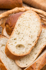 pieces of baguette with herbs in a basket