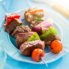 grilled beef shishkabobs on table