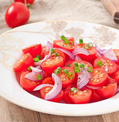 tomato cherry salad with  black pepper and onion