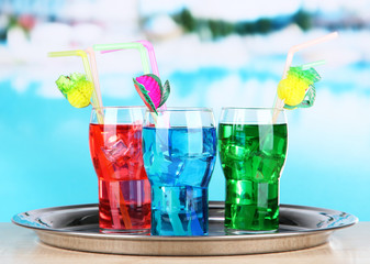 Different cocktails on bright background