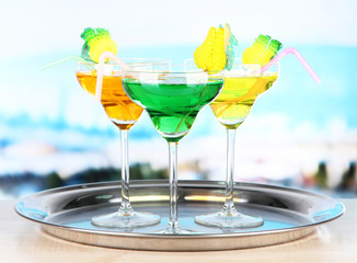 Different cocktails on bright background