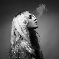 Beautiful lady smokes