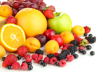 Fresh fruits and berries isolated on white