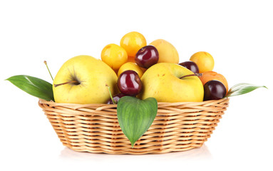 Bright summer fruits in basket isolated on white