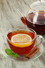 Cup of tea with lemon on table close-up