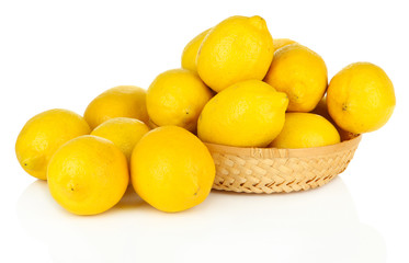 Ripe lemons in wicker basket isolated on white