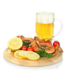 Boiled crabs with lemon slices and tomatoes,