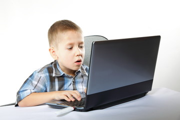 Computer addiction child with laptop notebook