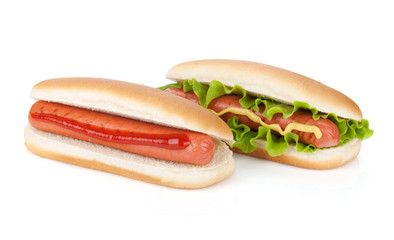 Two hot dogs with various ingredients